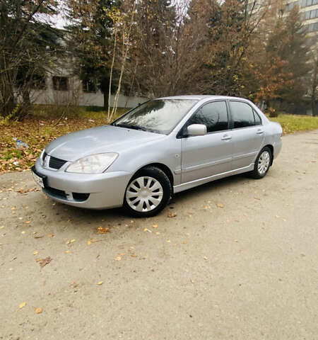 Серый Мицубиси Лансер, объемом двигателя 1.6 л и пробегом 253 тыс. км за 2850 $, фото 1 на Automoto.ua