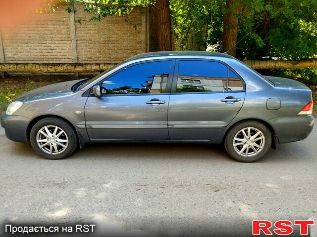 Серый Мицубиси Лансер, объемом двигателя 1.6 л и пробегом 214 тыс. км за 4500 $, фото 1 на Automoto.ua