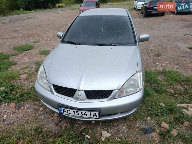 Сірий Міцубісі Lancer, об'ємом двигуна 1.58 л та пробігом 302 тис. км за 3200 $, фото 1 на Automoto.ua