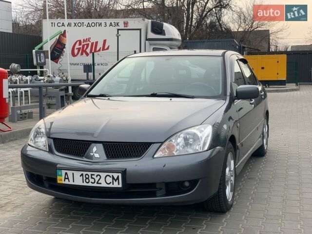 Серый Мицубиси Лансер, объемом двигателя 1.58 л и пробегом 170 тыс. км за 3850 $, фото 1 на Automoto.ua