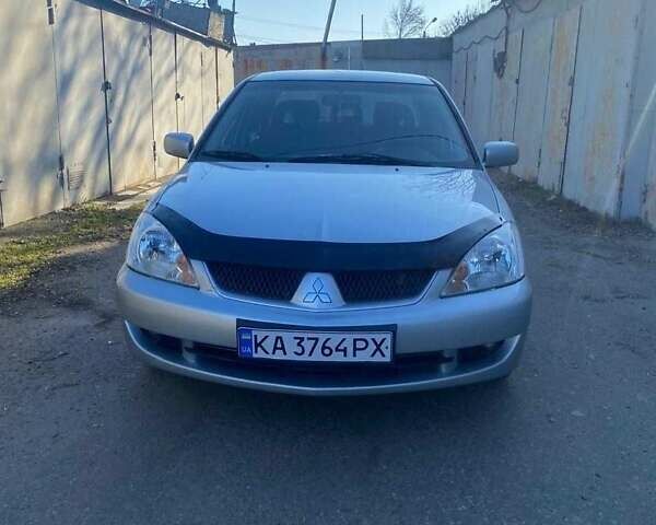 Серый Мицубиси Лансер, объемом двигателя 1.6 л и пробегом 288 тыс. км за 3800 $, фото 1 на Automoto.ua
