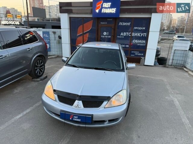 Серый Мицубиси Лансер, объемом двигателя 1.6 л и пробегом 241 тыс. км за 3499 $, фото 1 на Automoto.ua