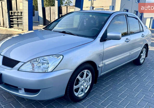 Сірий Міцубісі Lancer, об'ємом двигуна 1.6 л та пробігом 263 тис. км за 4900 $, фото 1 на Automoto.ua