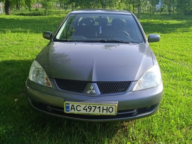 Сірий Міцубісі Lancer, об'ємом двигуна 1 л та пробігом 255 тис. км за 4500 $, фото 1 на Automoto.ua