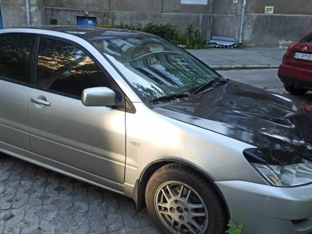 Серый Мицубиси Лансер, объемом двигателя 2 л и пробегом 273 тыс. км за 3500 $, фото 1 на Automoto.ua