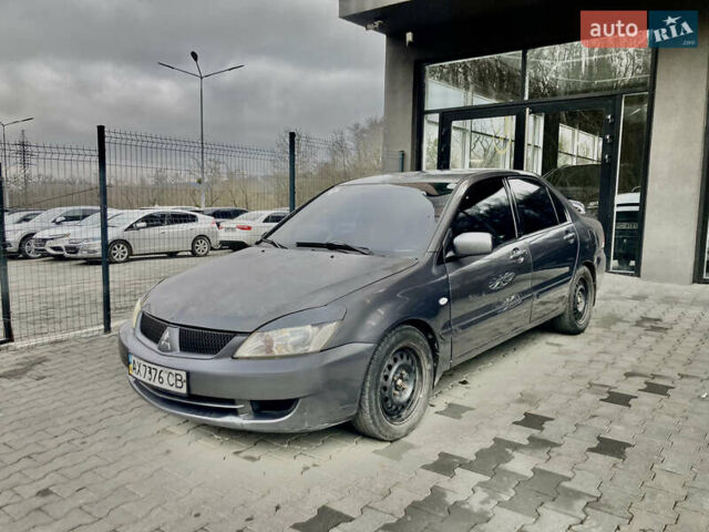 Серый Мицубиси Лансер, объемом двигателя 1.58 л и пробегом 223 тыс. км за 4800 $, фото 1 на Automoto.ua