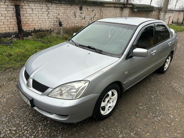 Сірий Міцубісі Lancer, об'ємом двигуна 1.6 л та пробігом 270 тис. км за 2900 $, фото 1 на Automoto.ua