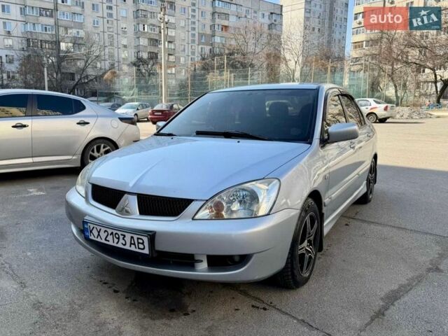 Серый Мицубиси Лансер, объемом двигателя 1.58 л и пробегом 224 тыс. км за 4000 $, фото 1 на Automoto.ua