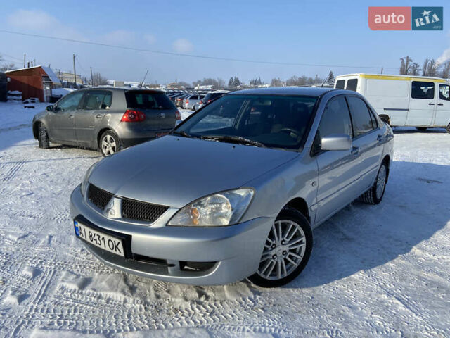 Сірий Міцубісі Lancer, об'ємом двигуна 1.6 л та пробігом 261 тис. км за 5100 $, фото 1 на Automoto.ua