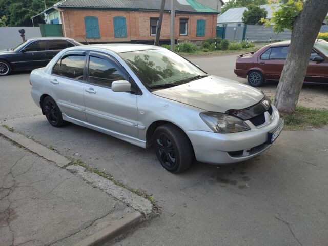 Сірий Міцубісі Lancer, об'ємом двигуна 1.6 л та пробігом 230 тис. км за 3850 $, фото 1 на Automoto.ua