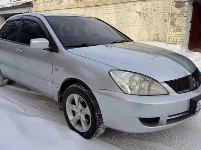 Сірий Міцубісі Lancer, об'ємом двигуна 1.6 л та пробігом 240 тис. км за 5500 $, фото 1 на Automoto.ua