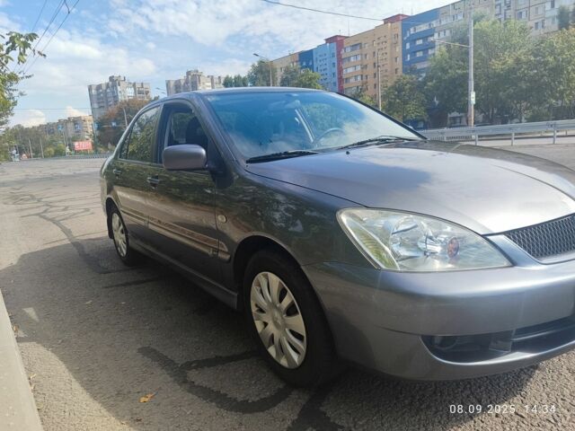 Сірий Міцубісі Lancer, об'ємом двигуна 1.6 л та пробігом 240 тис. км за 4400 $, фото 1 на Automoto.ua