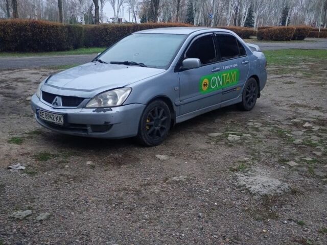 Сірий Міцубісі Lancer, об'ємом двигуна 1.6 л та пробігом 264 тис. км за 3200 $, фото 1 на Automoto.ua
