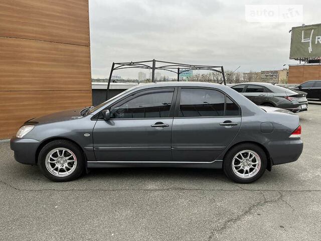 Сірий Міцубісі Lancer, об'ємом двигуна 1.6 л та пробігом 260 тис. км за 4998 $, фото 1 на Automoto.ua