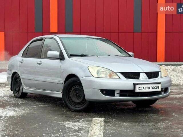 Серый Мицубиси Лансер, объемом двигателя 1.6 л и пробегом 263 тыс. км за 4190 $, фото 1 на Automoto.ua