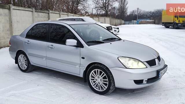 Серый Мицубиси Лансер, объемом двигателя 1.8 л и пробегом 190 тыс. км за 5500 $, фото 1 на Automoto.ua