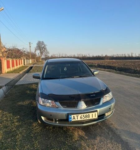 Серый Мицубиси Лансер, объемом двигателя 1.58 л и пробегом 290 тыс. км за 3000 $, фото 1 на Automoto.ua