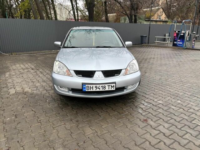 Серый Мицубиси Лансер, объемом двигателя 1.6 л и пробегом 260 тыс. км за 4999 $, фото 1 на Automoto.ua