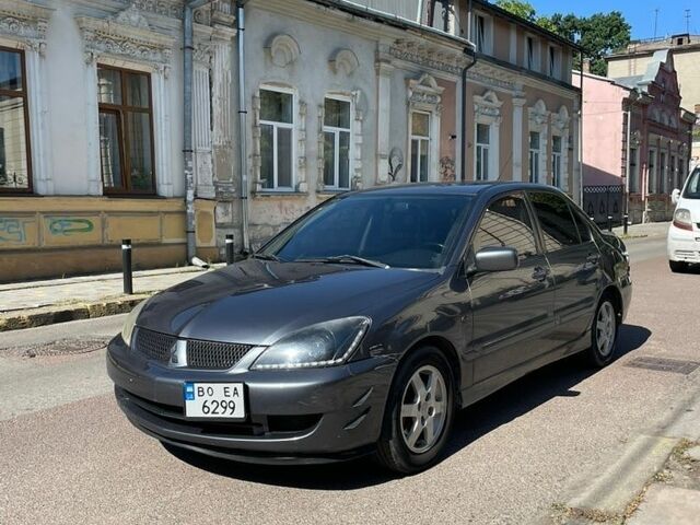 Серый Мицубиси Лансер, объемом двигателя 1.6 л и пробегом 186 тыс. км за 3100 $, фото 1 на Automoto.ua