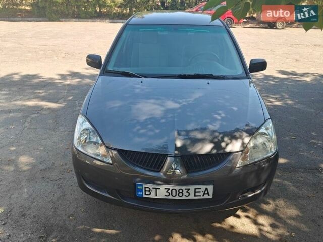 Серый Мицубиси Лансер, объемом двигателя 1.3 л и пробегом 230 тыс. км за 4400 $, фото 1 на Automoto.ua