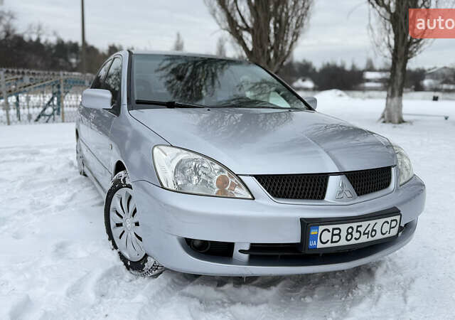 Серый Мицубиси Лансер, объемом двигателя 1.6 л и пробегом 264 тыс. км за 3950 $, фото 1 на Automoto.ua