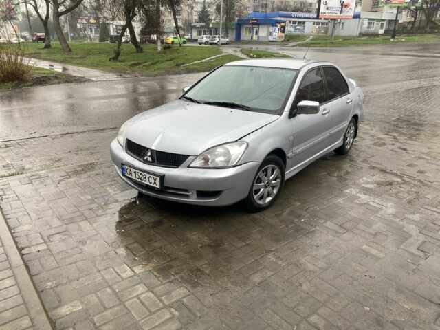 Серый Мицубиси Лансер, объемом двигателя 1.6 л и пробегом 250 тыс. км за 2350 $, фото 1 на Automoto.ua