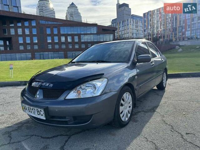 Сірий Міцубісі Lancer, об'ємом двигуна 1.58 л та пробігом 276 тис. км за 3650 $, фото 1 на Automoto.ua