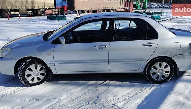 Сірий Міцубісі Lancer, об'ємом двигуна 1.6 л та пробігом 163 тис. км за 5000 $, фото 1 на Automoto.ua
