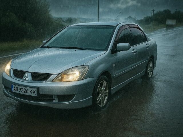 Серый Мицубиси Лансер, объемом двигателя 2 л и пробегом 306 тыс. км за 4100 $, фото 1 на Automoto.ua