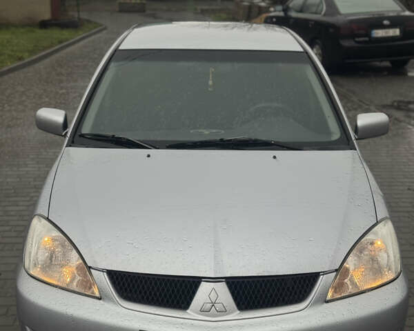 Серый Мицубиси Лансер, объемом двигателя 1.6 л и пробегом 280 тыс. км за 2800 $, фото 1 на Automoto.ua