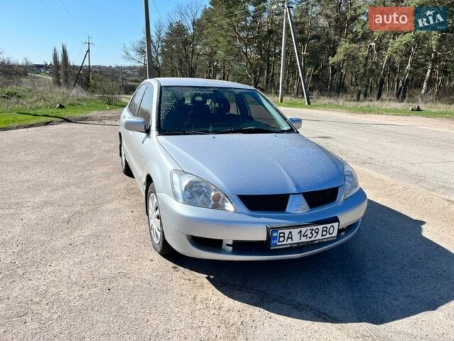 Серый Мицубиси Лансер, объемом двигателя 1.58 л и пробегом 350 тыс. км за 4550 $, фото 1 на Automoto.ua