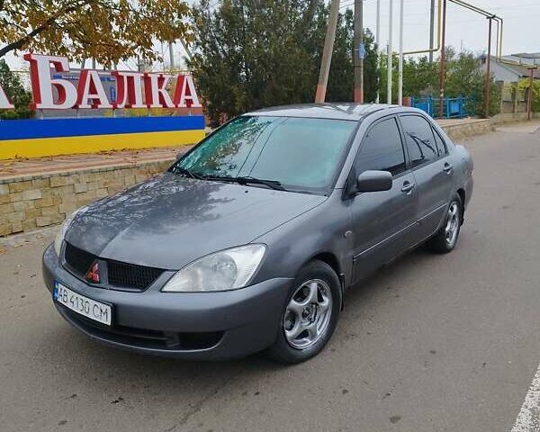 Серый Мицубиси Лансер, объемом двигателя 1.6 л и пробегом 250 тыс. км за 3800 $, фото 1 на Automoto.ua