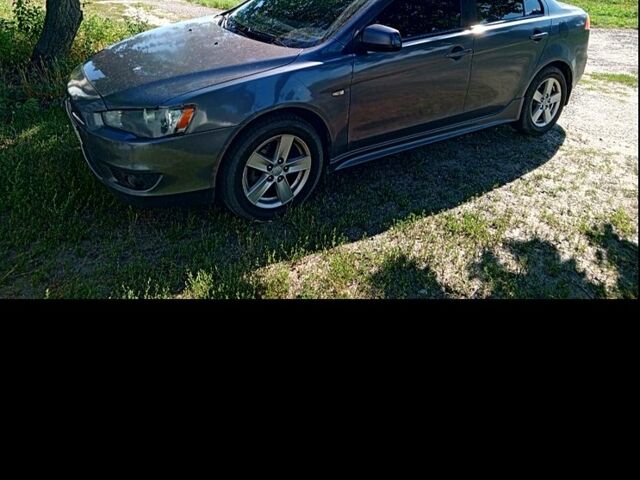 Серый Мицубиси Лансер, объемом двигателя 2 л и пробегом 244 тыс. км за 7000 $, фото 1 на Automoto.ua