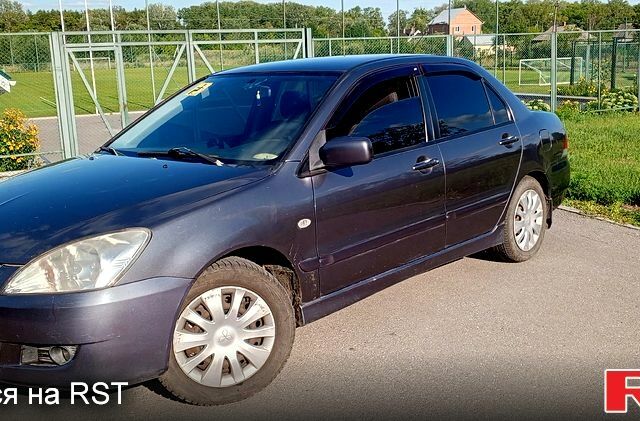 Сірий Міцубісі Lancer, об'ємом двигуна 1.6 л та пробігом 300 тис. км за 4400 $, фото 1 на Automoto.ua