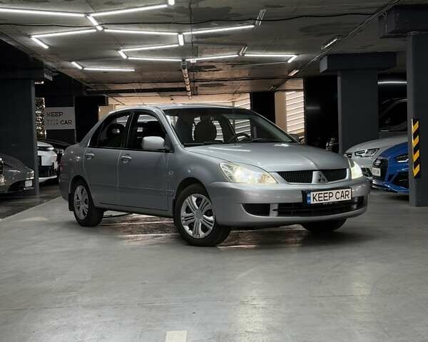 Серый Мицубиси Лансер, объемом двигателя 1.58 л и пробегом 271 тыс. км за 4200 $, фото 1 на Automoto.ua