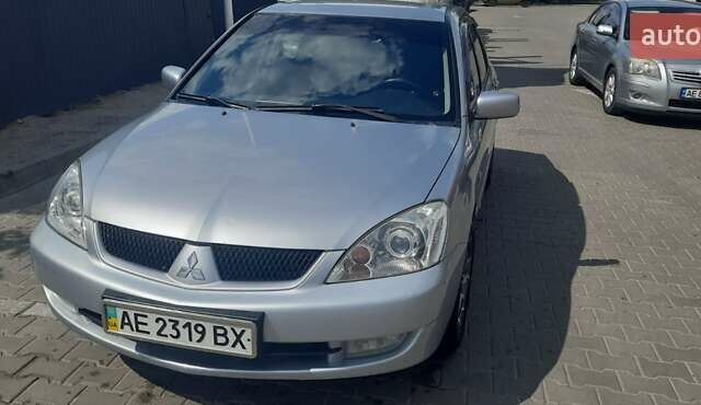 Серый Мицубиси Лансер, объемом двигателя 1.6 л и пробегом 420 тыс. км за 4900 $, фото 1 на Automoto.ua