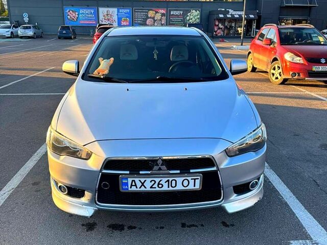 Серый Мицубиси Лансер, объемом двигателя 2 л и пробегом 122 тыс. км за 8200 $, фото 1 на Automoto.ua