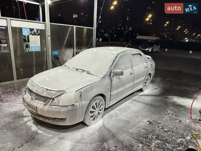 Серый Мицубиси Лансер, объемом двигателя 1.6 л и пробегом 115 тыс. км за 2800 $, фото 1 на Automoto.ua