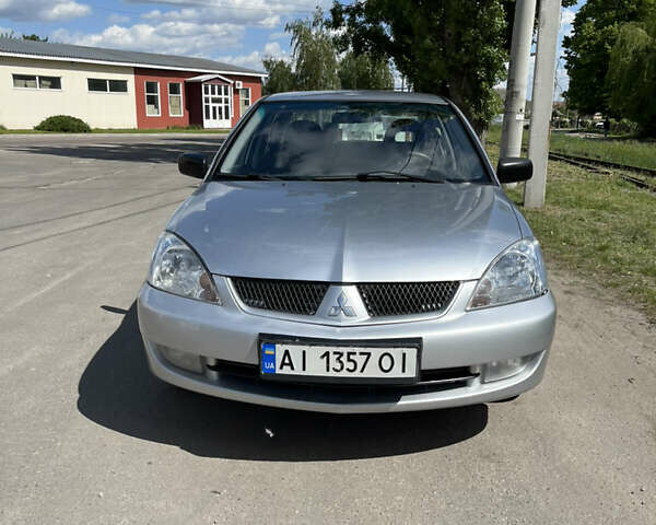 Сірий Міцубісі Lancer, об'ємом двигуна 1.6 л та пробігом 226 тис. км за 4000 $, фото 1 на Automoto.ua