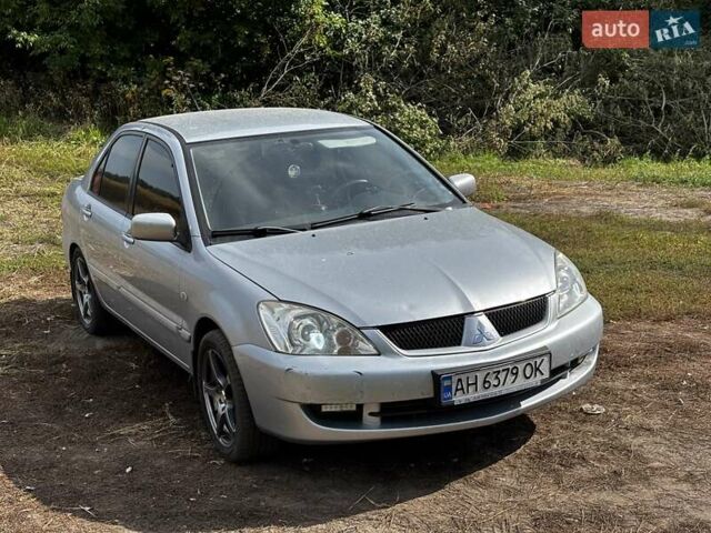 Серый Мицубиси Лансер, объемом двигателя 1.6 л и пробегом 222 тыс. км за 5300 $, фото 1 на Automoto.ua