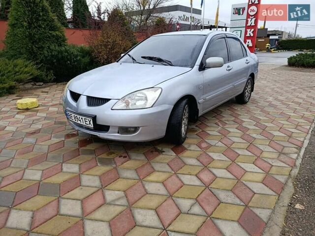 Серый Мицубиси Лансер, объемом двигателя 1.6 л и пробегом 268 тыс. км за 2900 $, фото 1 на Automoto.ua