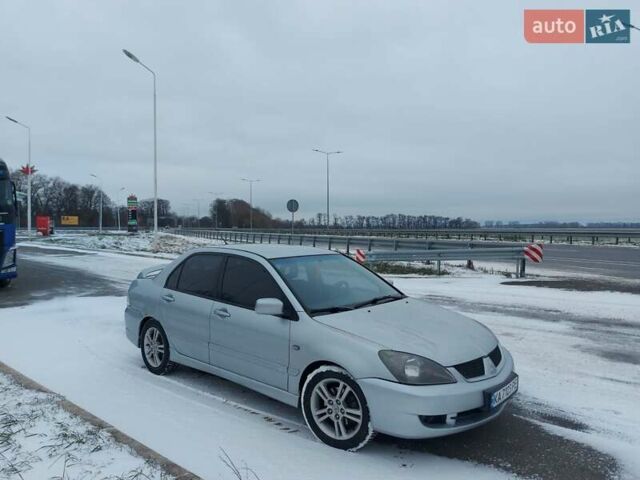 Серый Мицубиси Лансер, объемом двигателя 2 л и пробегом 253 тыс. км за 4200 $, фото 1 на Automoto.ua