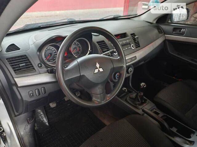 Серый Мицубиси Лансер, объемом двигателя 1.5 л и пробегом 200 тыс. км за 5100 $, фото 1 на Automoto.ua