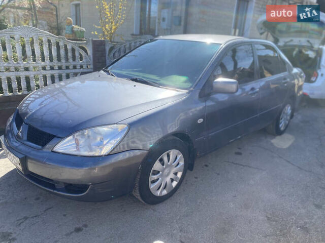 Сірий Міцубісі Lancer, об'ємом двигуна 1.59 л та пробігом 275 тис. км за 2999 $, фото 1 на Automoto.ua