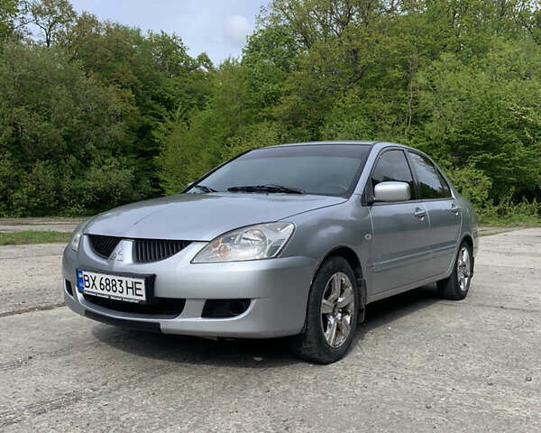 Сірий Міцубісі Lancer, об'ємом двигуна 1.59 л та пробігом 252 тис. км за 3900 $, фото 1 на Automoto.ua