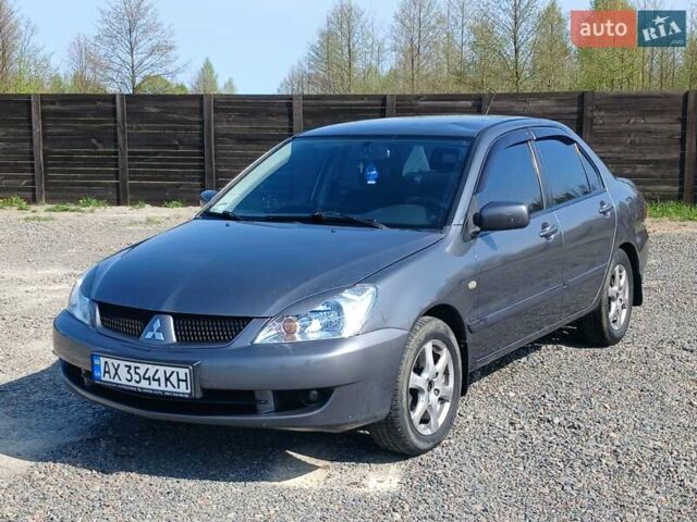 Сірий Міцубісі Lancer, об'ємом двигуна 1.58 л та пробігом 260 тис. км за 4000 $, фото 1 на Automoto.ua