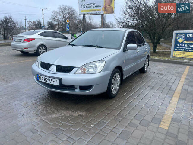 Серый Мицубиси Лансер, объемом двигателя 1.58 л и пробегом 221 тыс. км за 4729 $, фото 1 на Automoto.ua