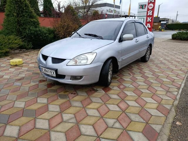 Серый Мицубиси Лансер, объемом двигателя 1.6 л и пробегом 238 тыс. км за 2900 $, фото 1 на Automoto.ua