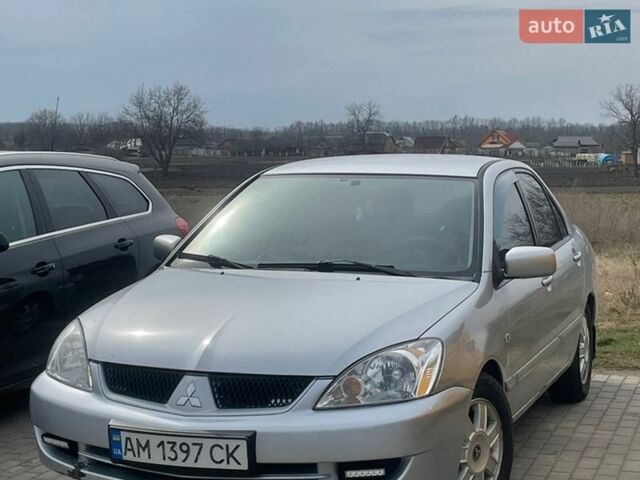 Серый Мицубиси Лансер, объемом двигателя 1.6 л и пробегом 207 тыс. км за 3399 $, фото 1 на Automoto.ua