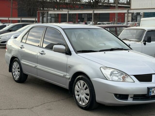 Серый Мицубиси Лансер, объемом двигателя 1.6 л и пробегом 195 тыс. км за 5300 $, фото 1 на Automoto.ua